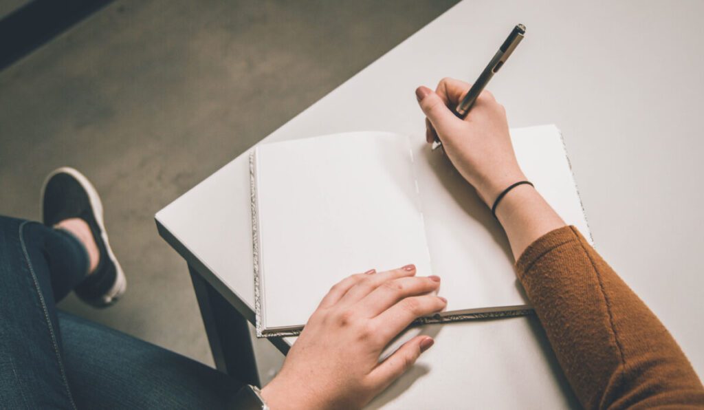 Notebook and Lady Writing